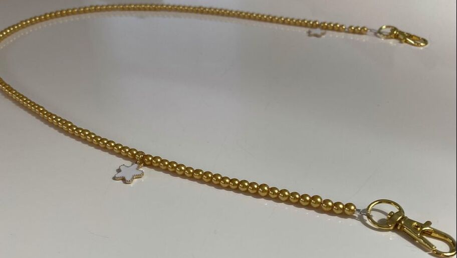 gold beaded chain with star charms